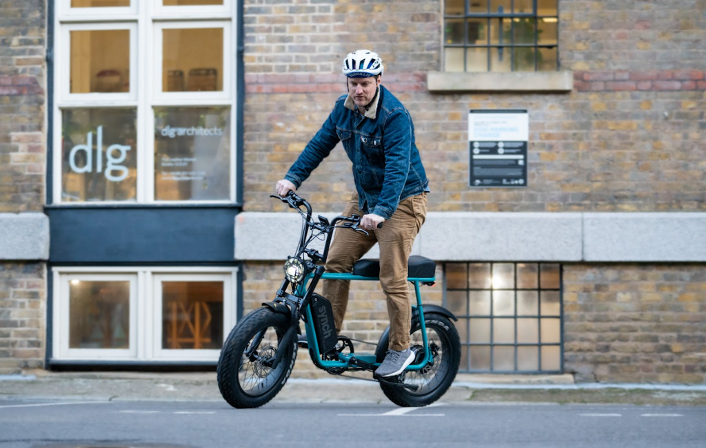 person riding a synch super monkey electric bike