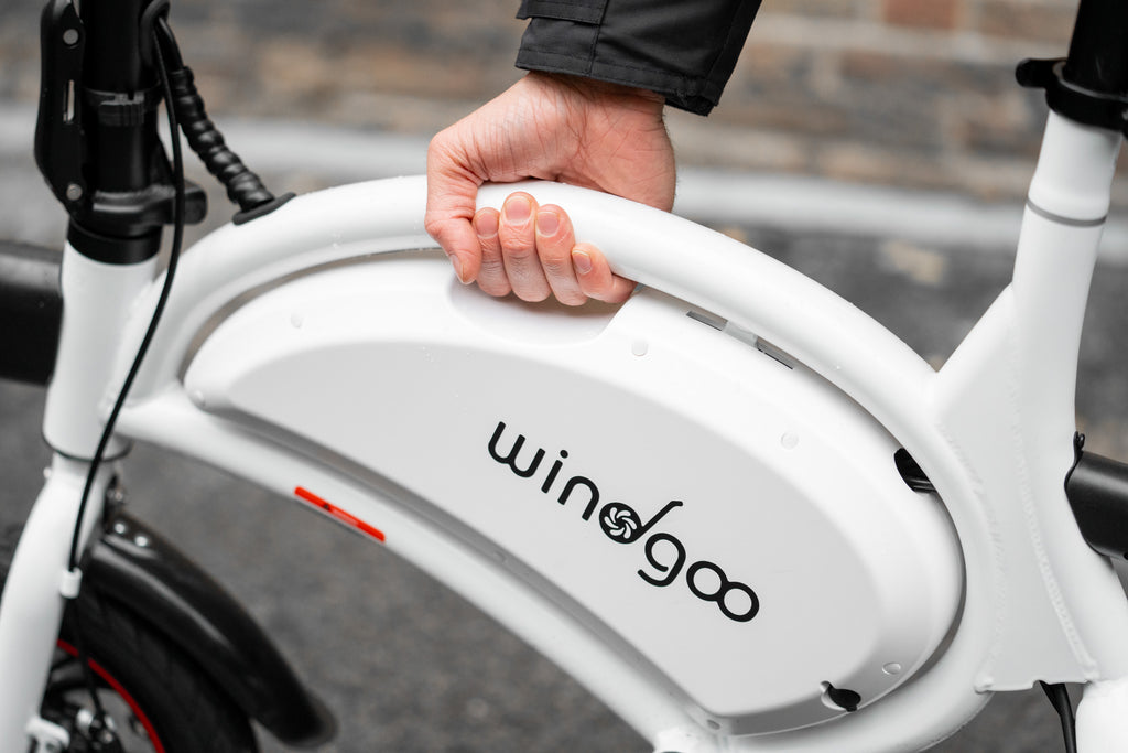 person holding a Windgoo B3 electric bike