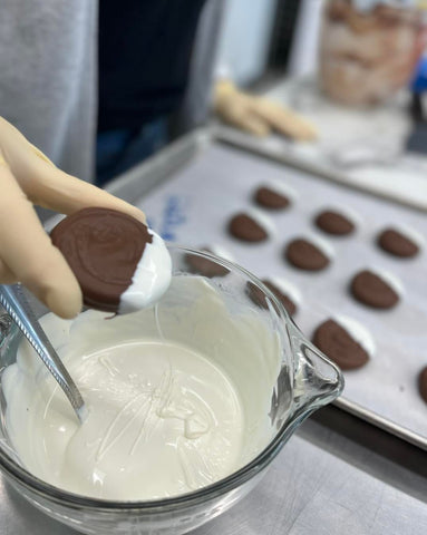 Gluten-free chocolate dipped oreos dipped in a separate container