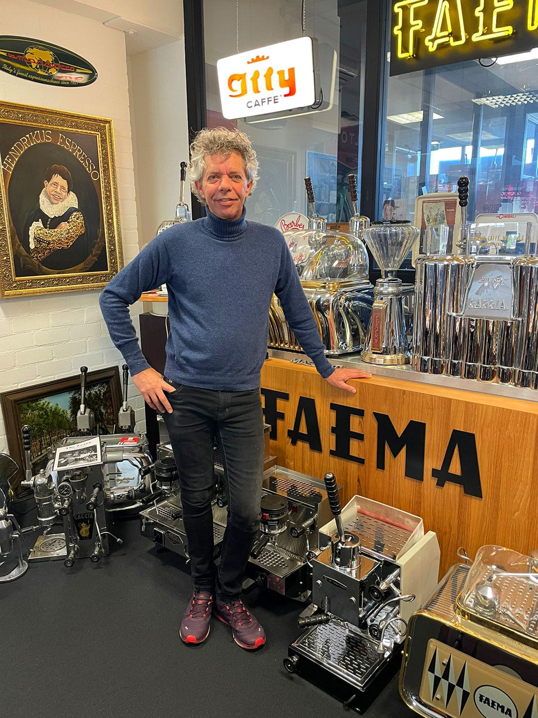 Henk Langkemper with his collection of lever espresso machines