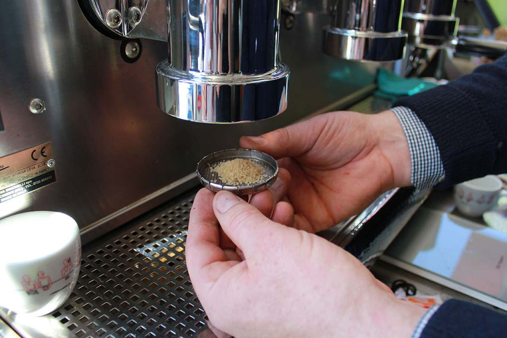 Granulated sugar trick to remove the showerscreen on an espresso machine