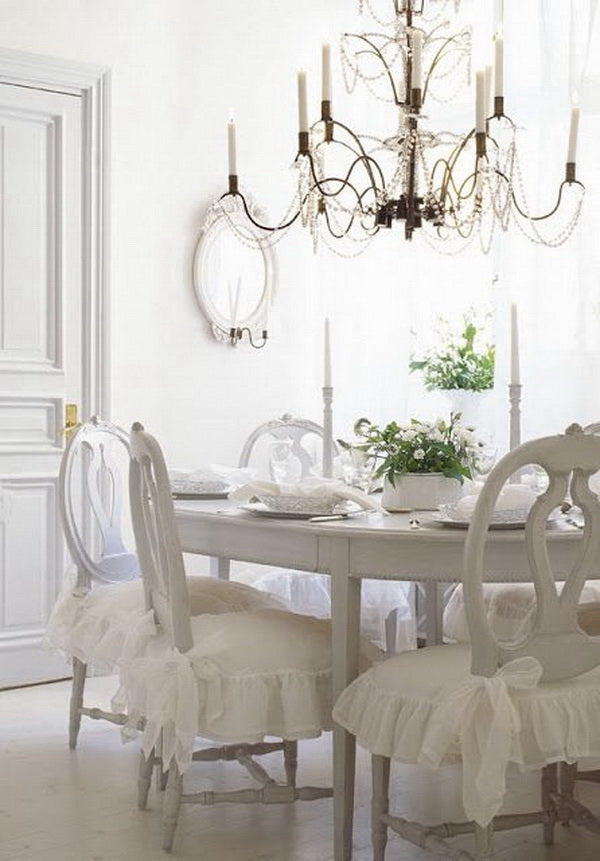 white shabby chic dining room with French shabby chic chairs with frilly white aprons