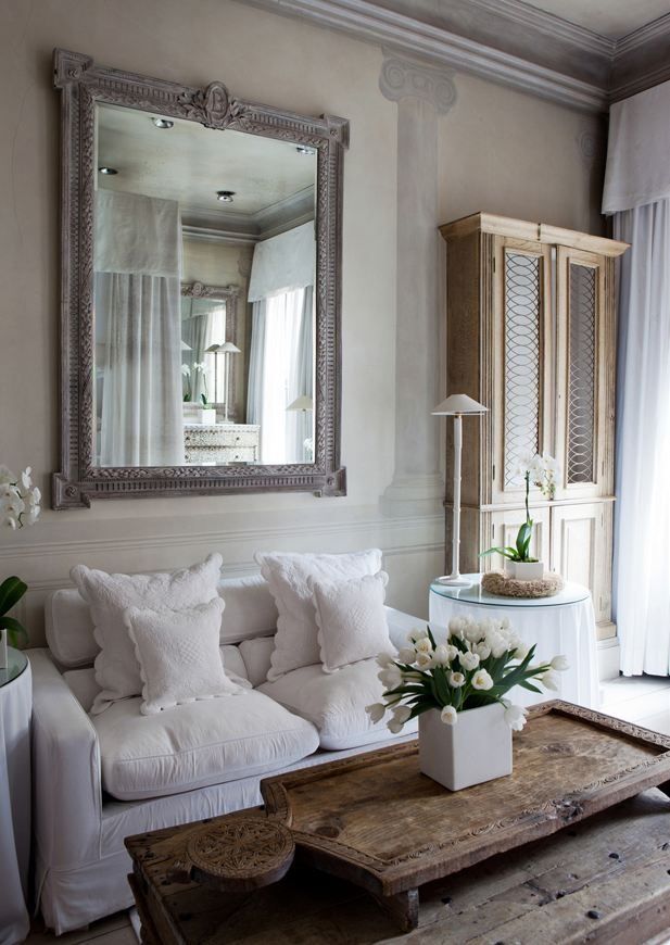 A distressed mirror adds rustic charm.