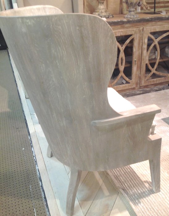 french wood carved chair with modern appeal