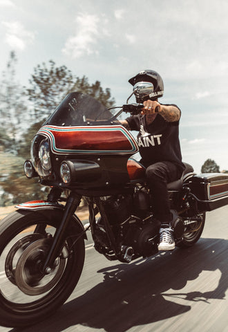 rider driving red motorcycle