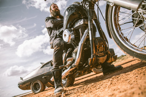 rider sitting on bike in dirt