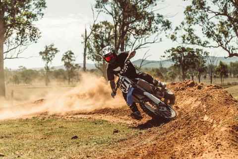 rider skidding with dirt