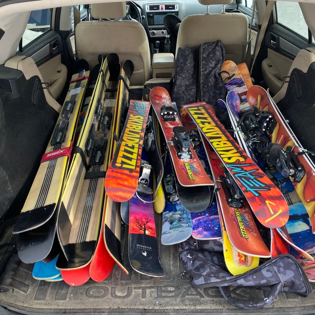 pile of j skis in the back of the car after proto testing