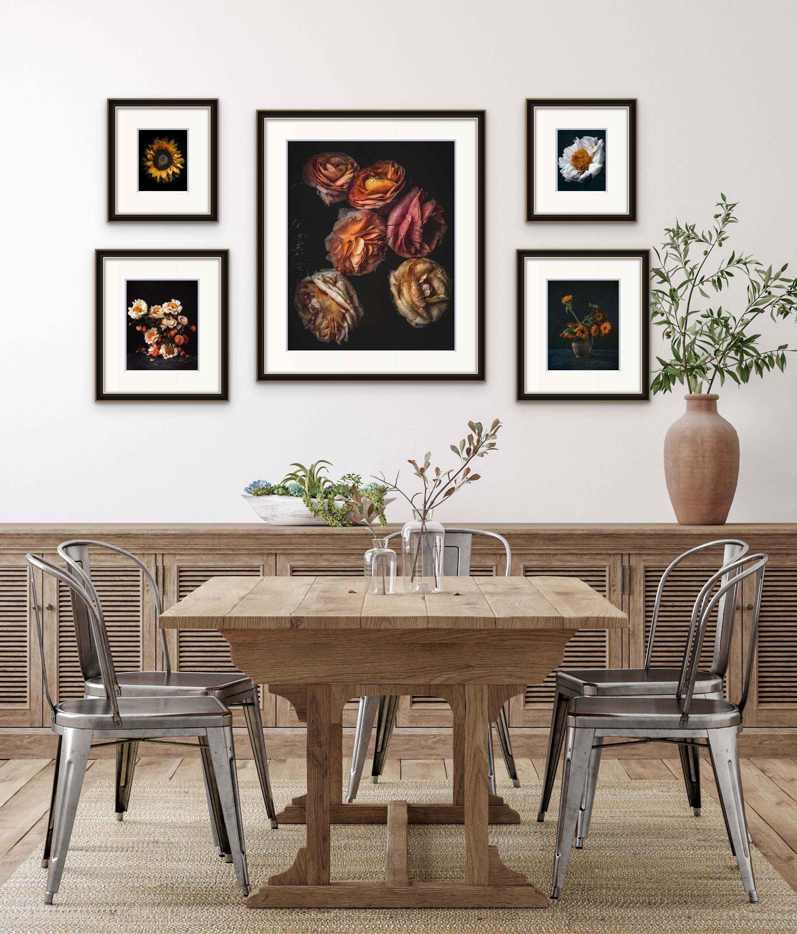 framed flower art prints on wall above table