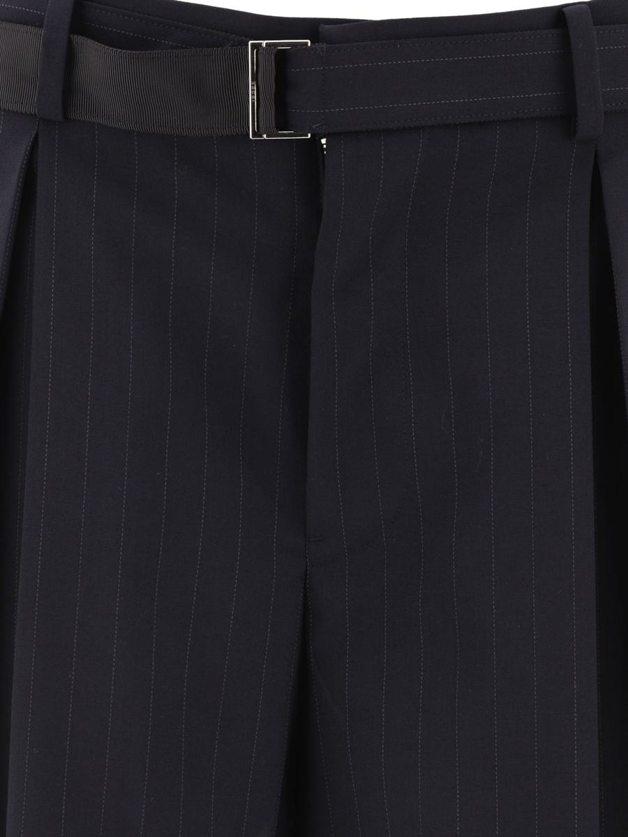 Shop Sacai Pinstriped Trousers In Blue