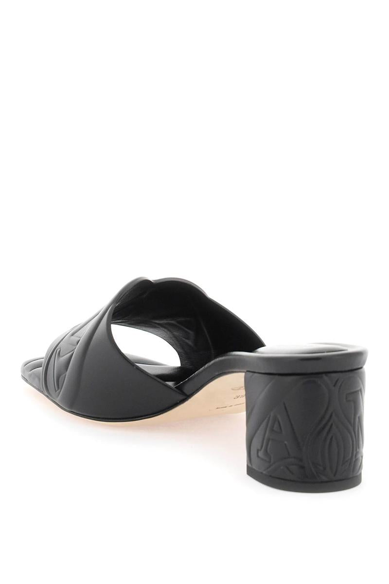 Shop Alexander Mcqueen Embossed Logo Leather Mules In Nero