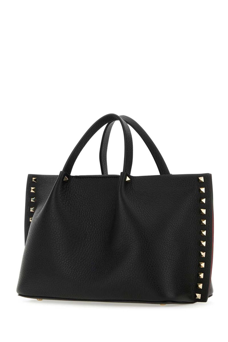 Shop Valentino Garavani Handbags. In Black