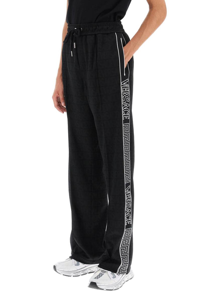 Shop Versace Greca Joggers In Nero