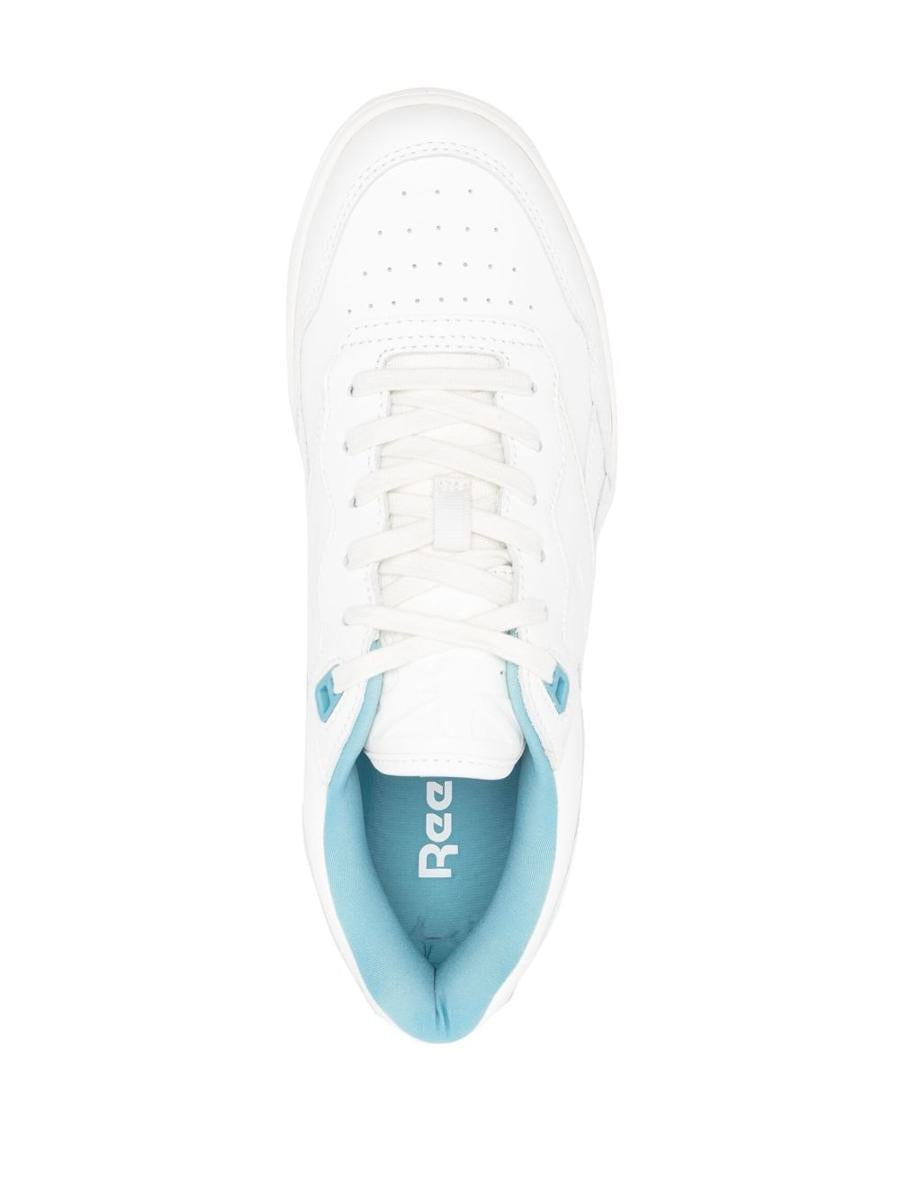 Shop Reebok Sneakers In White