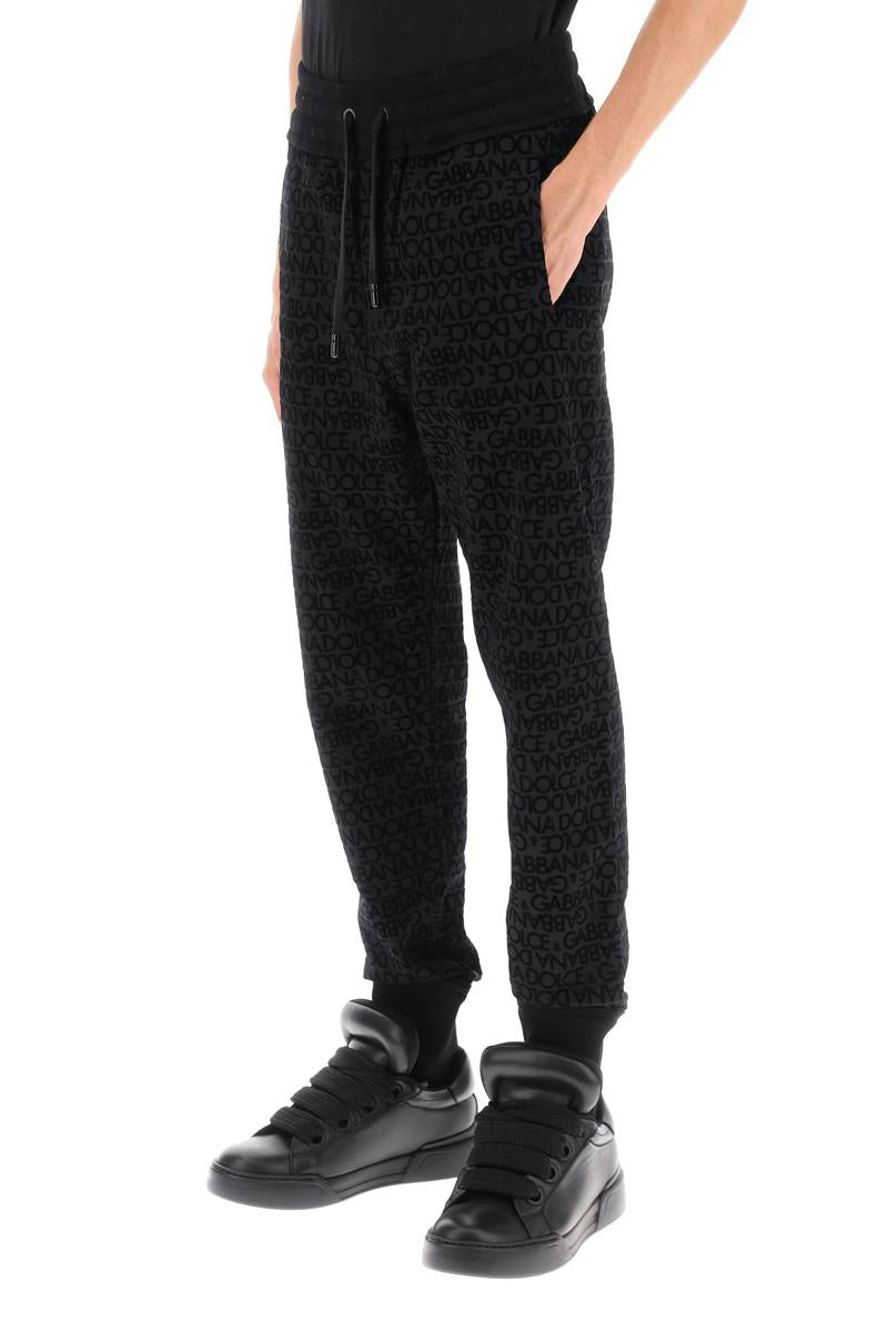 Shop Dolce & Gabbana Flocked-logo Joggers In Nero