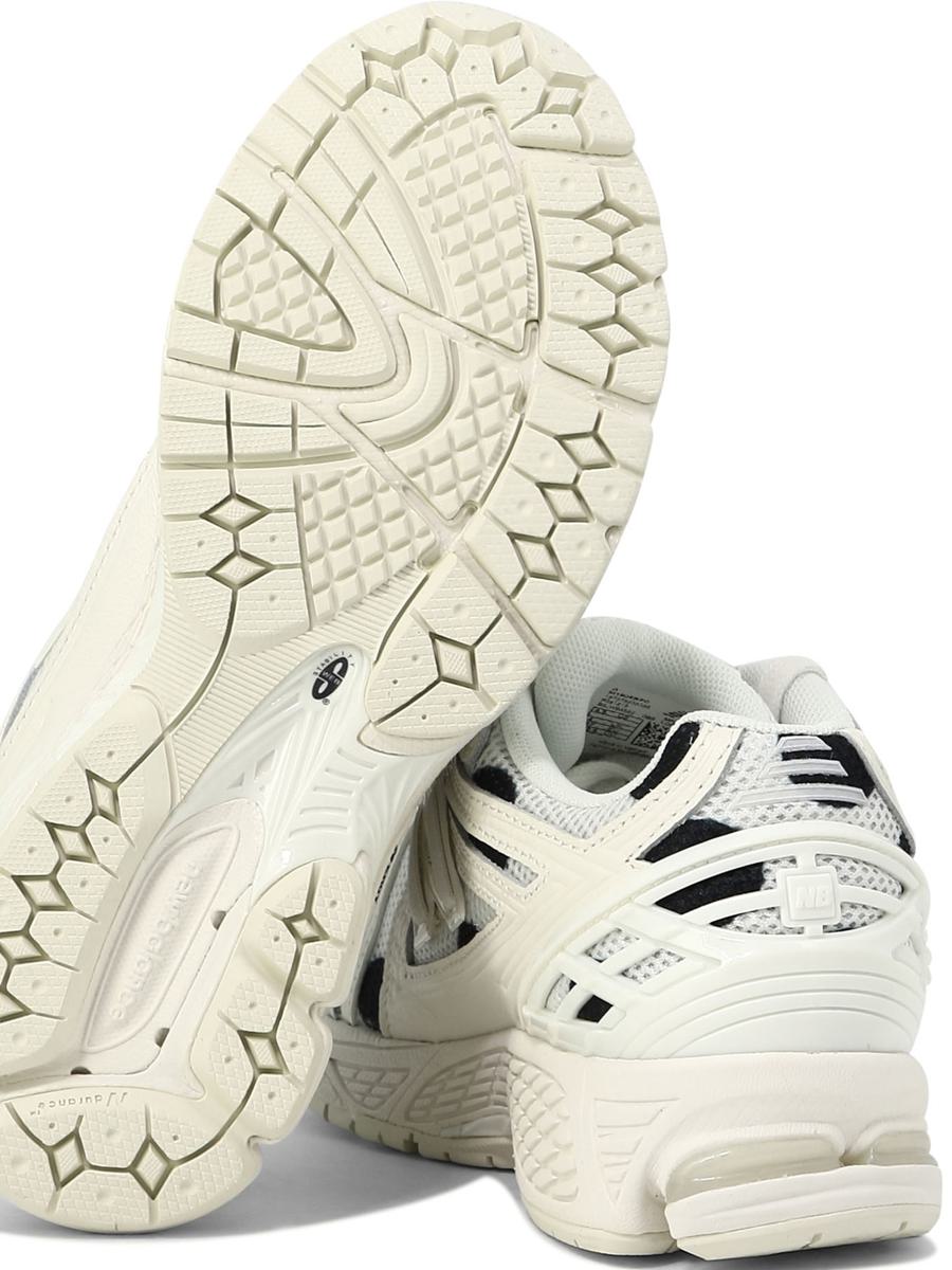 Shop New Balance "1906" Sneakers In White