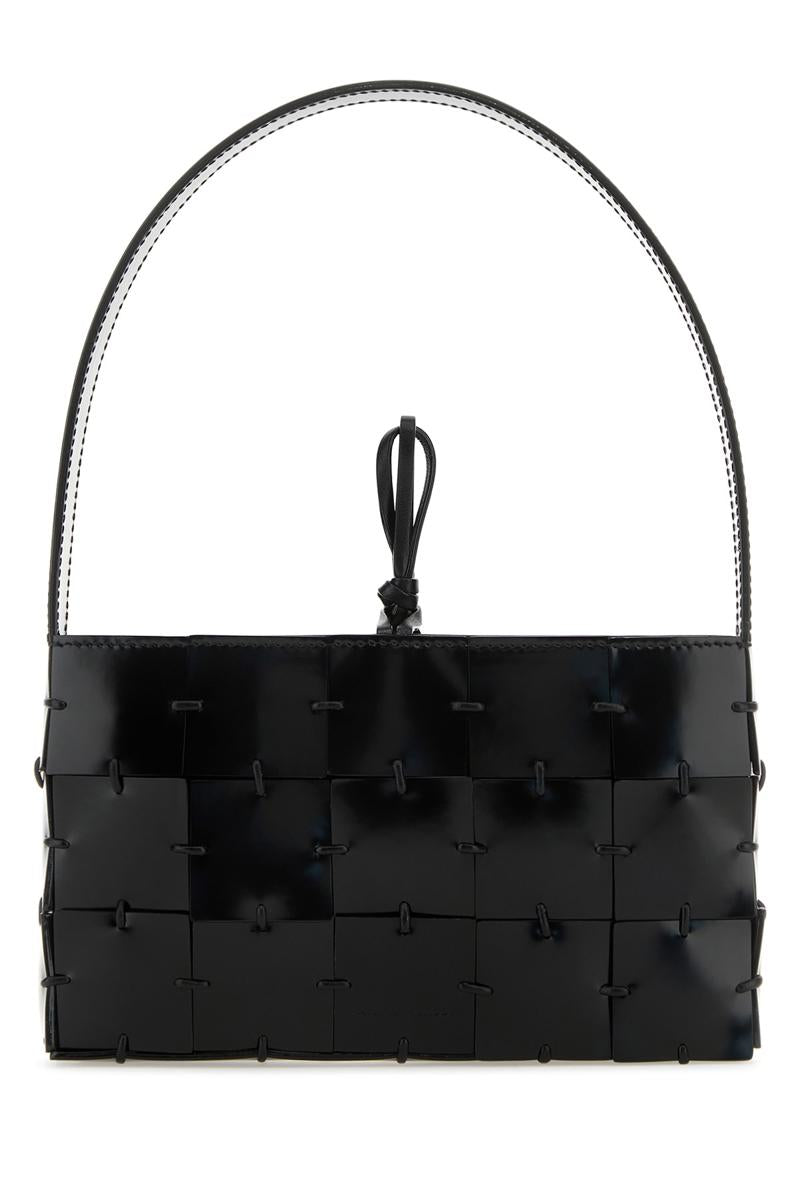 Amina Muaddi Handbags. In Black