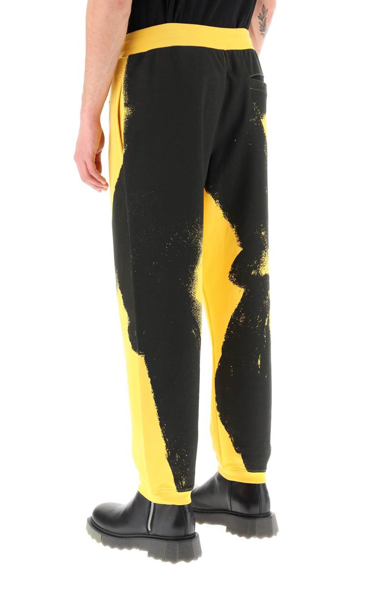 Shop Moschino Graphic Print Jogger Pants With Logo In Giallo