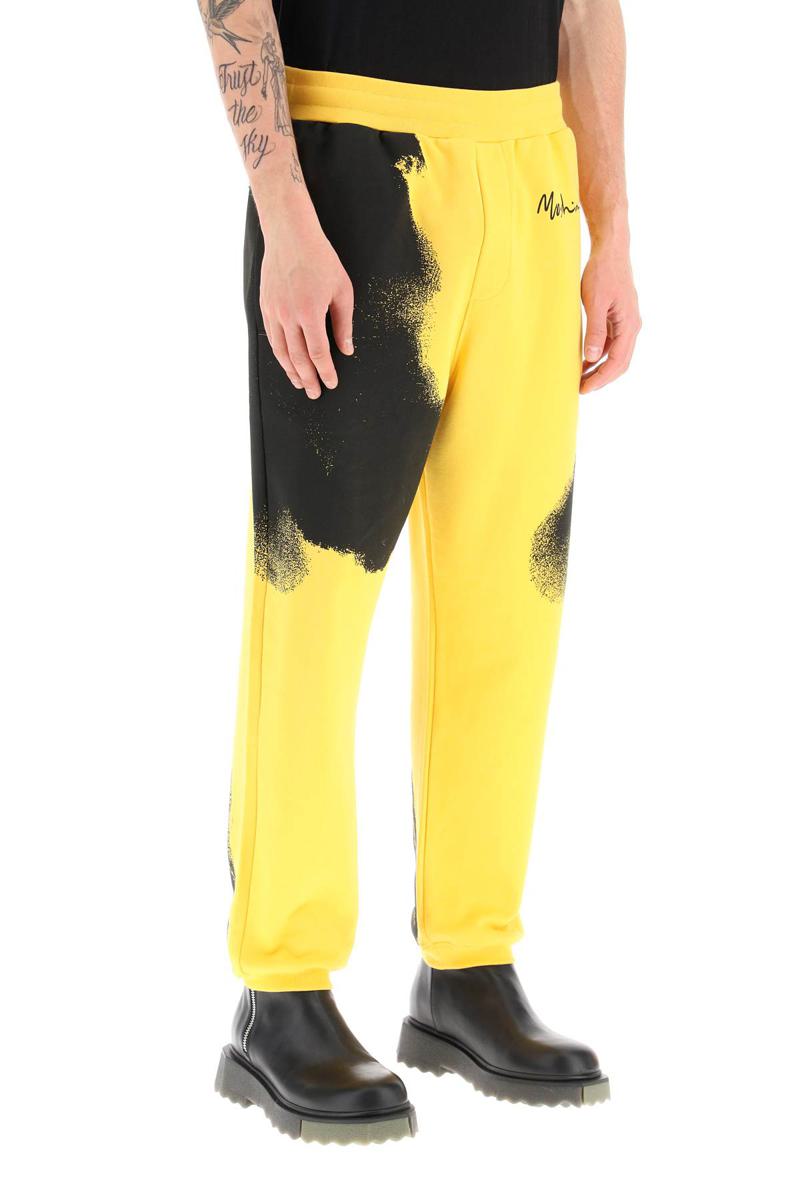 Shop Moschino Graphic Print Jogger Pants With Logo In Giallo