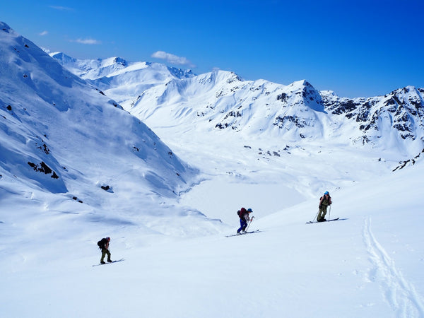 Female splitboarders on a skin track