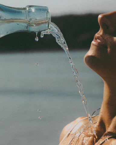 GIRL POURING WATER ON HERSELF