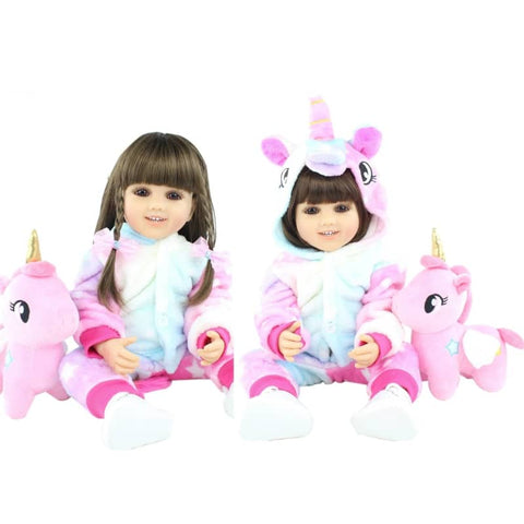 Bambole reborn femmine con pigiama e peluche gigante unicorno