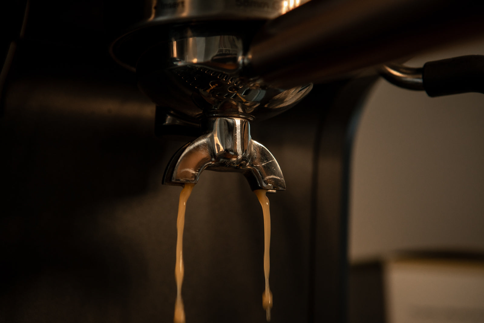 thin coffee pouring from espresso machine