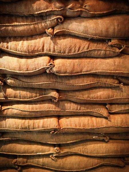 coffee sacks after harvest stacked on top of each other