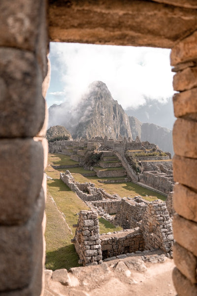 View through doorway over Peruvian ruins in the Andes