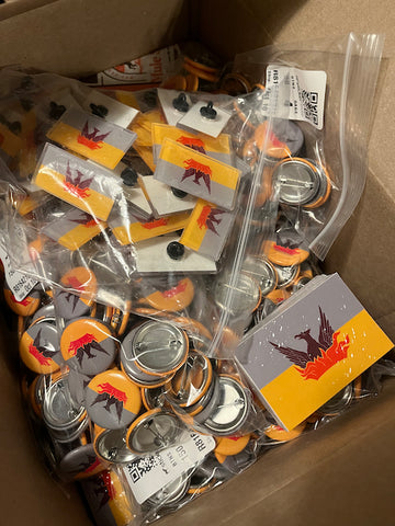 box of SF Fog & Gold Flag stickers, buttons, pins and magnets