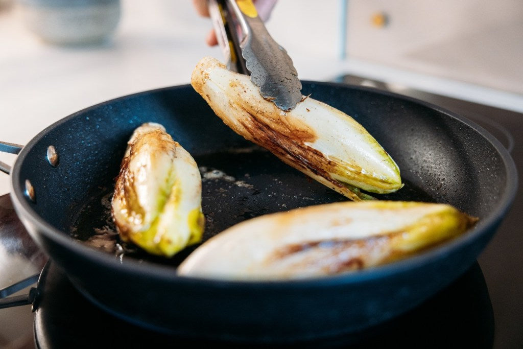 chicory heads cooking in butter 