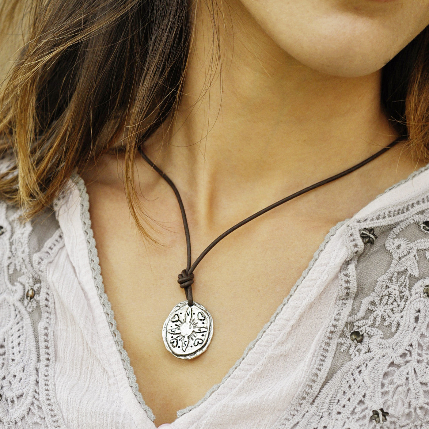 Compass necklace with the inspiring words 