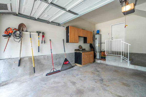 garage with wall mounted cabinets