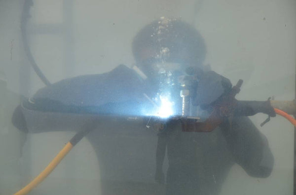 welder working underwater