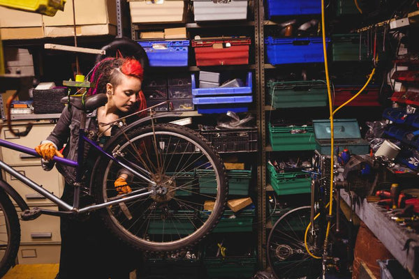 woman storing camping gear in garage