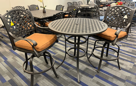 Dark cast-aluminum weave pattern bar table, and bar chairs with rich brown colored cushion.