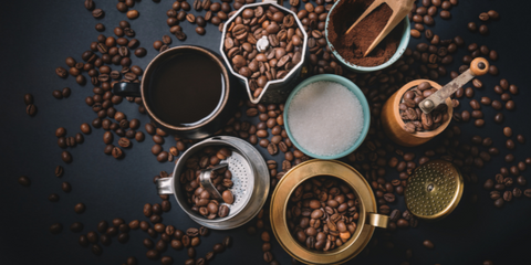 Top view on table with Equipment for preparing coffee surrounded with coffee beans. Preparing coffee concept.