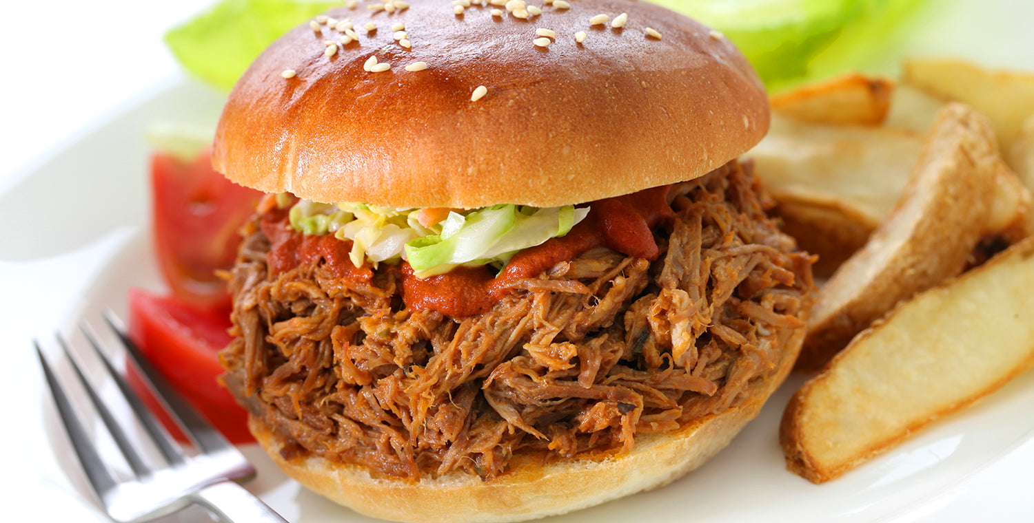 pulled pork on a sesame seed bun