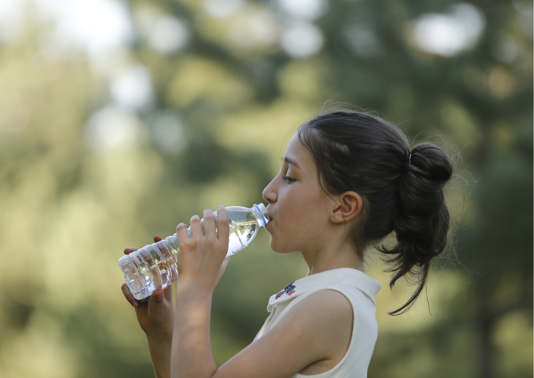 Girl drinking bottled water