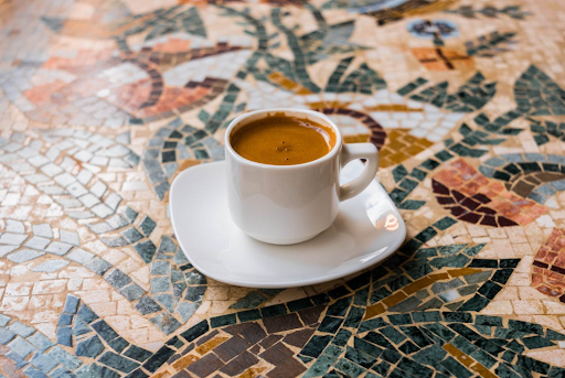 mug filled with coffee on saucer