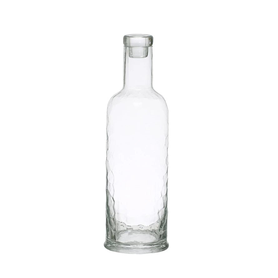 https://cdn.shopify.com/s/files/1/0275/1876/3088/products/hammered-glass-carafe-with-stopper-32oz-212567_1445x.webp?v=1694320329