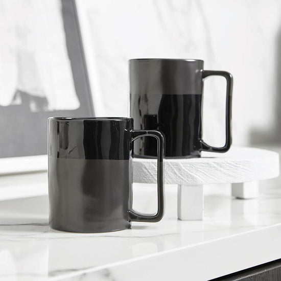 https://cdn.shopify.com/s/files/1/0275/1876/3088/products/organic-mug-matte-glossy-black-set-of-4-410602_550x.jpg?v=1671251739