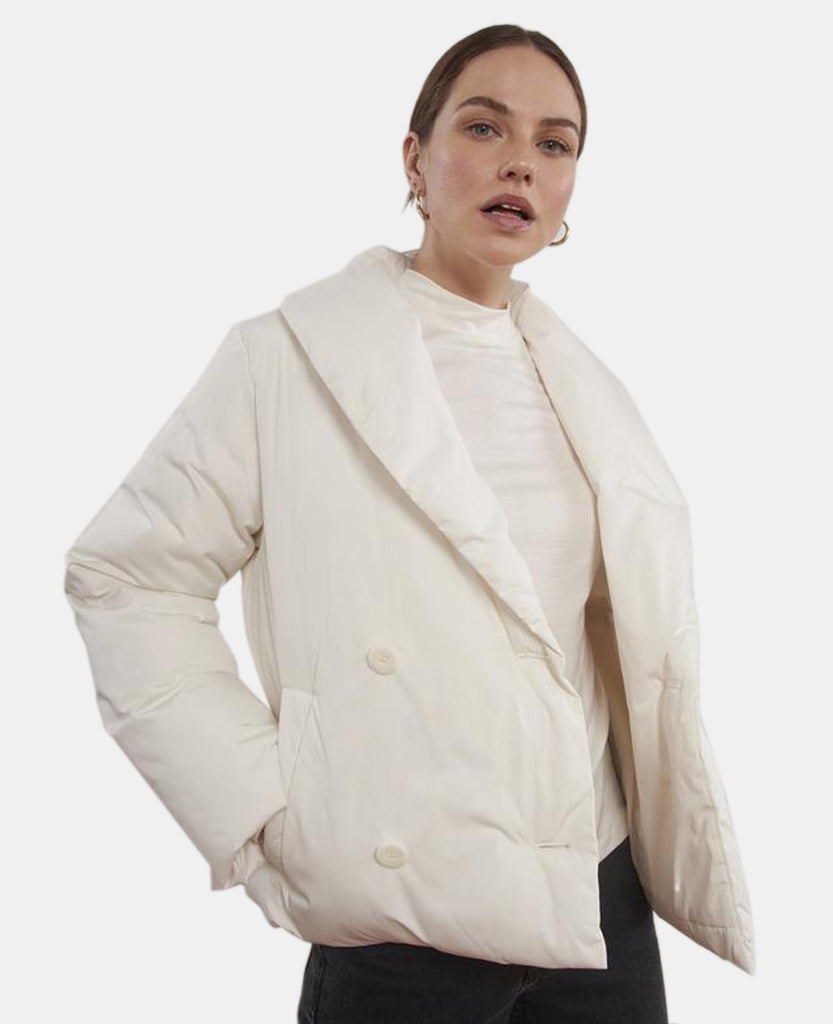 Eartha Padded Cropped Jacket Cream is a blazer styled jacket . It has deep pockets on either side and is white cream in colour.