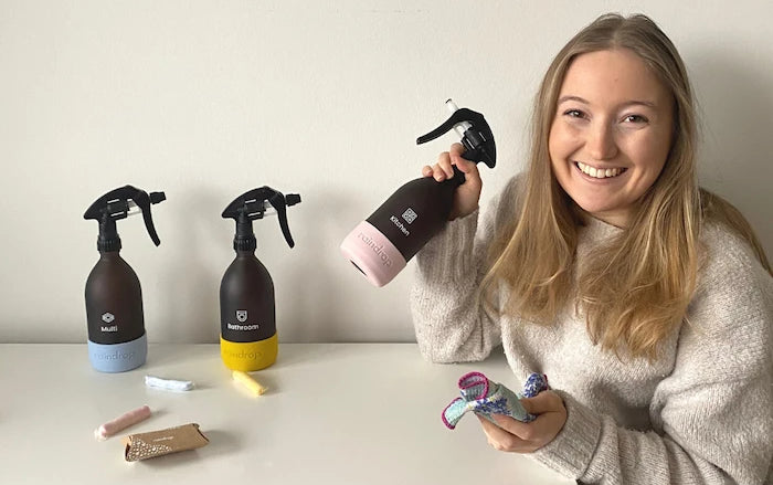 Woman holding Raindrop plastic free cleaning products