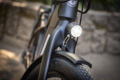 Image of a Schwinn electric bicycle with the lights on