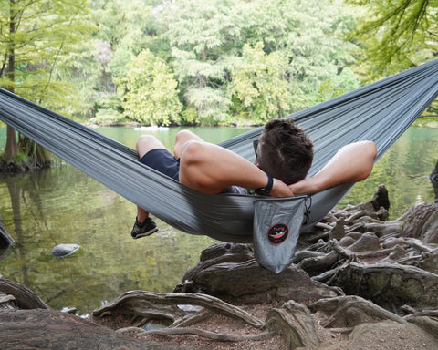 Erik our co-founder, sitting in our gray hammock kit at Red Bud Isle in Austin, TX. 