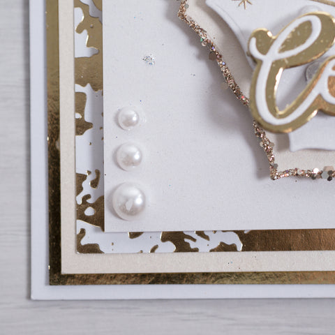 Learn how to create this party streamer celebration card using our free card-making tutorial. In this silver and gold card you’ll be using the stars and streamers from our new stamps to create this beautiful project.