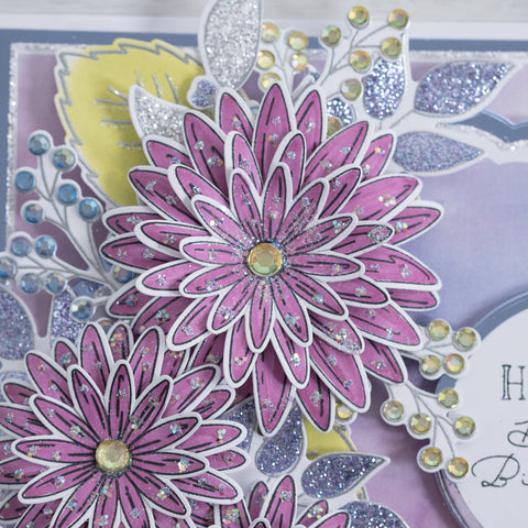 Pretty purple dahlia flowers with glitter encrusted foliage leaves - a beautiful birthday card.