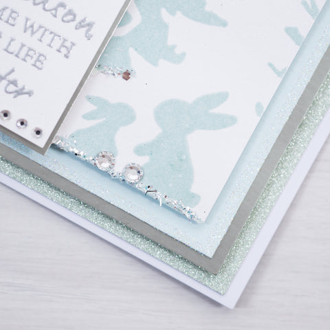 Learn how to make your own Christmas cards at home by following this free step-by-step tutorial from Chloes Creative Cards showing you how to make this icy blue and white reindeer winter wonderland scene.