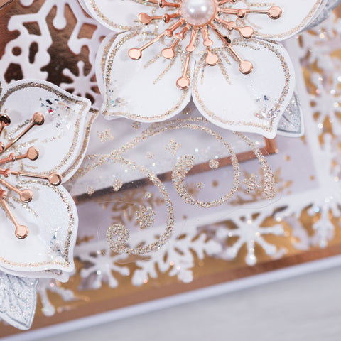 Learn how to make this beautiful rose gold and white Christmas Wreath card featuring our gorgeous 3D Christmas Rose stamp set and our new Snowflake Frames Die set to add a snowy detail to your card edges.